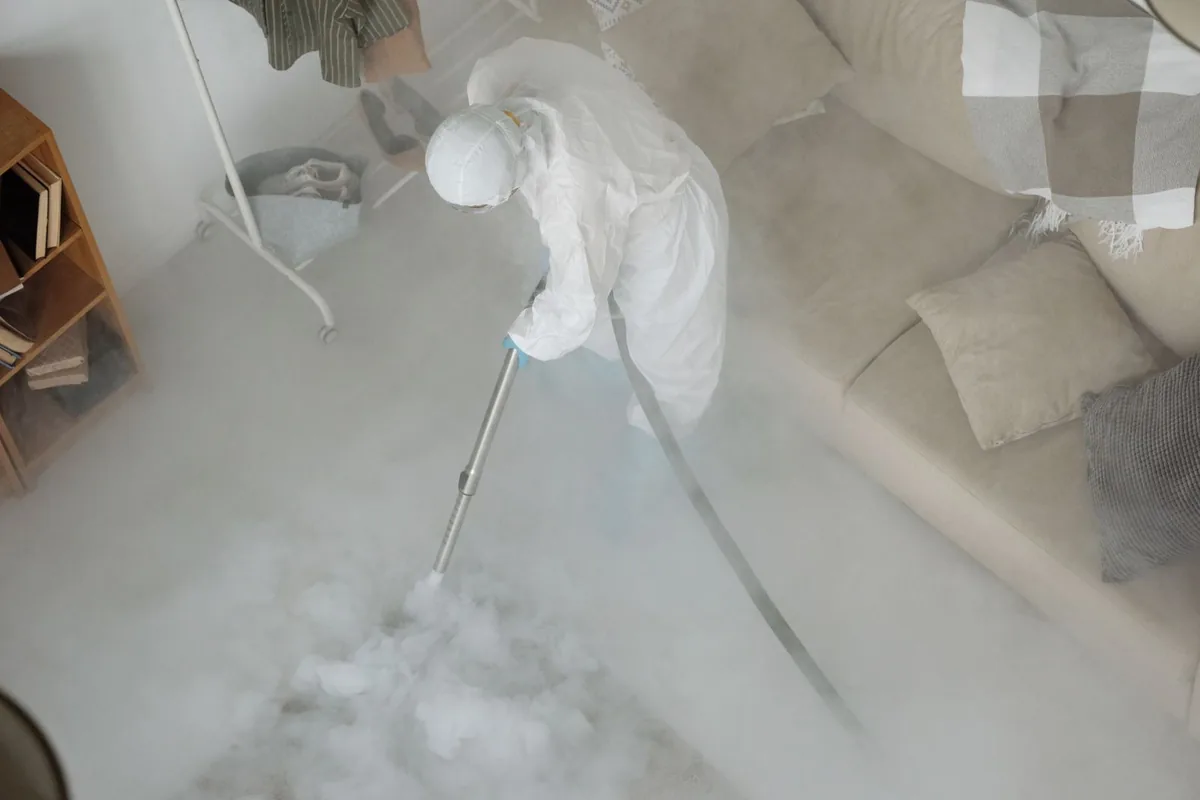 Biohazard cleanup technician in protective equipment, Mountain Park, GA